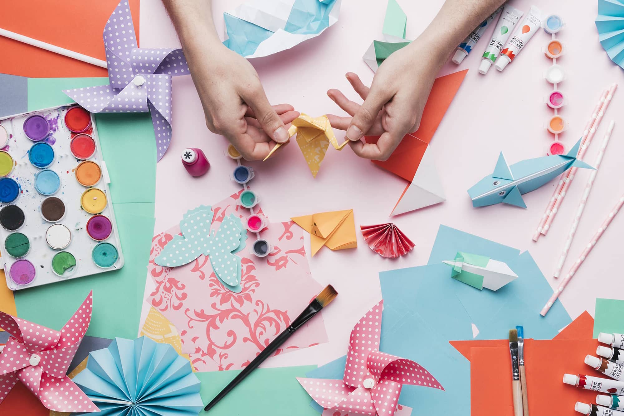 human-hand-holding-origami-bird-over-craft-product (1)